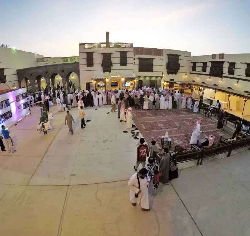 Visitors gathering inside the Bayt Al Madinah cultural event environment